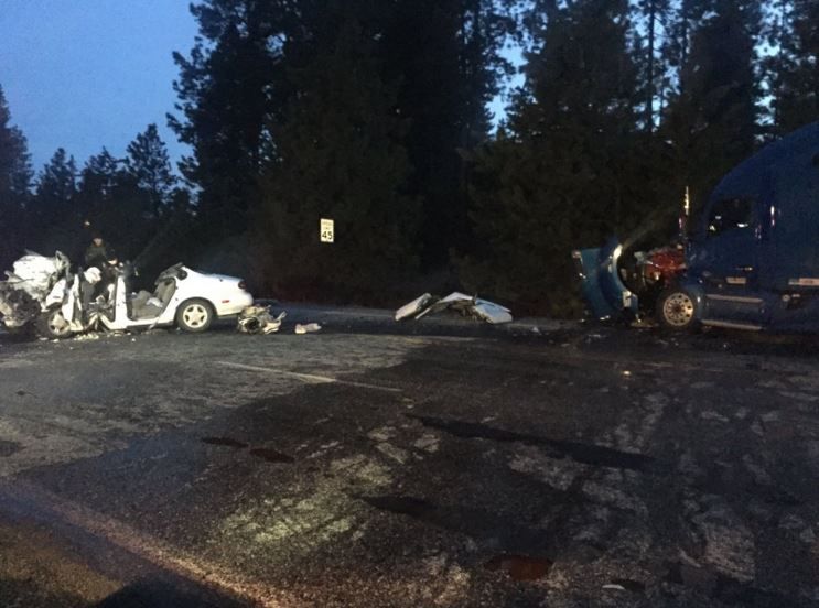 Woman dies after headon crash between car and semi at Bigelow G