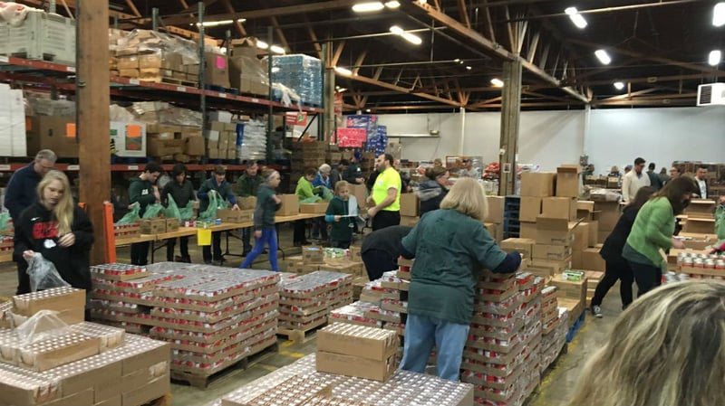 Second Harvest volunteers build 12,000 meals for students - Spokane ...