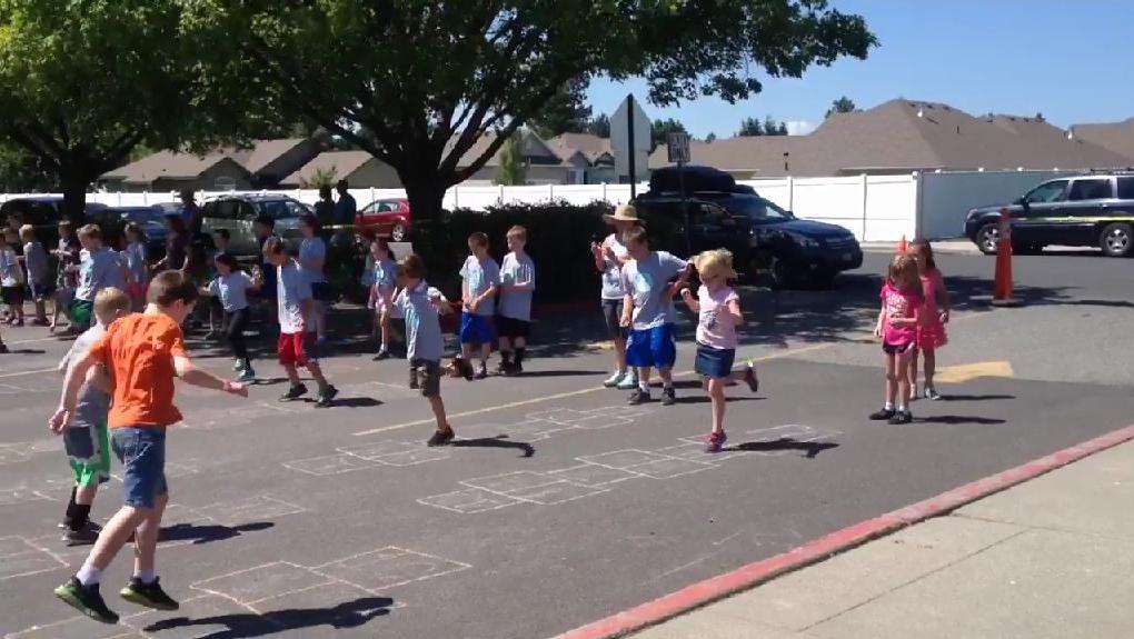 Mullan Road Elementary students hopscotch toward a Guinness Worl ...